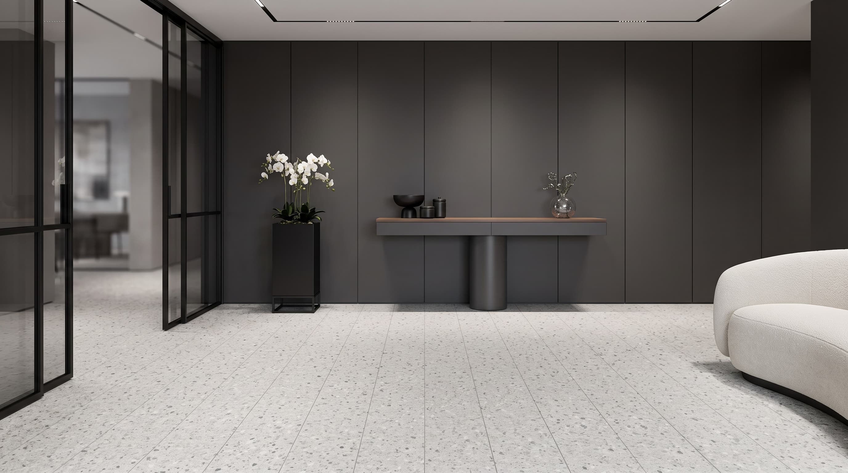 Dark Monaco Terrazzo surfaces applied to furniture and flooring in a sophisticated contemporary interior